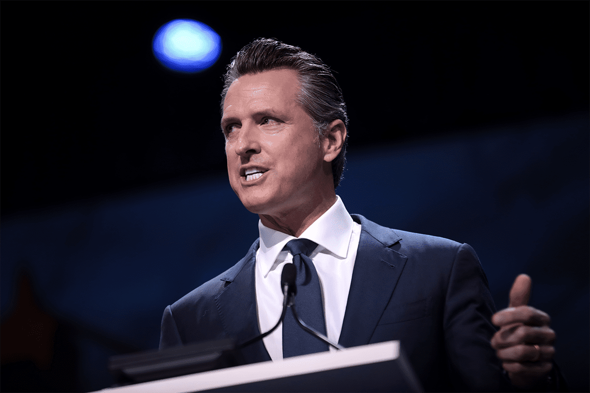 Governor Gavin Newsom speaking with attendees at the 2019 California Democratic Party State Convention at the George R. Moscone Convention Center in San Francisco, California (Gage Skidmore).