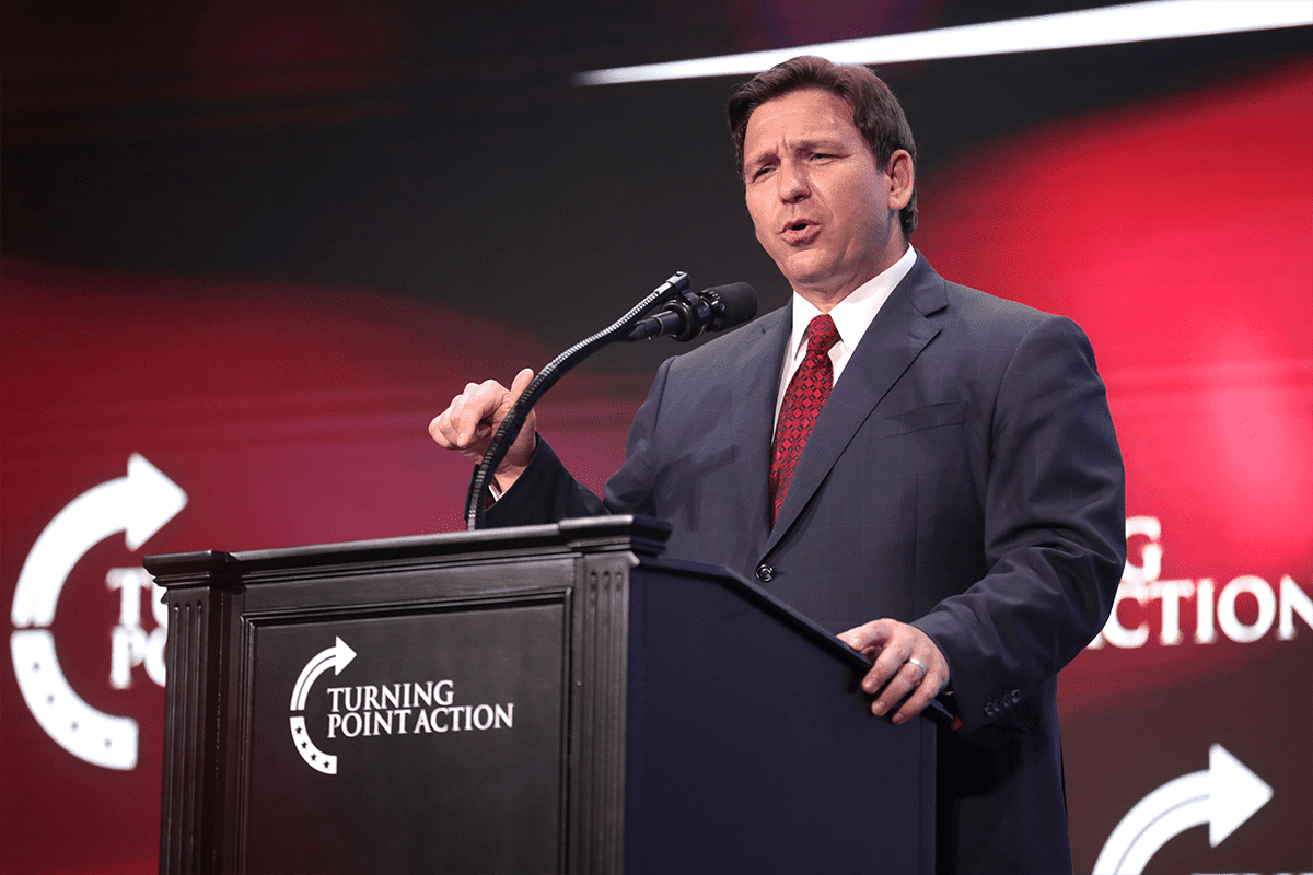 Governor Ron DeSantis speaking with attendees at a 
