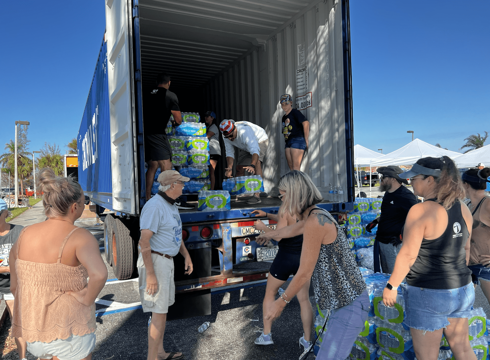 Volunteers help distribute food at Cape Christian. 