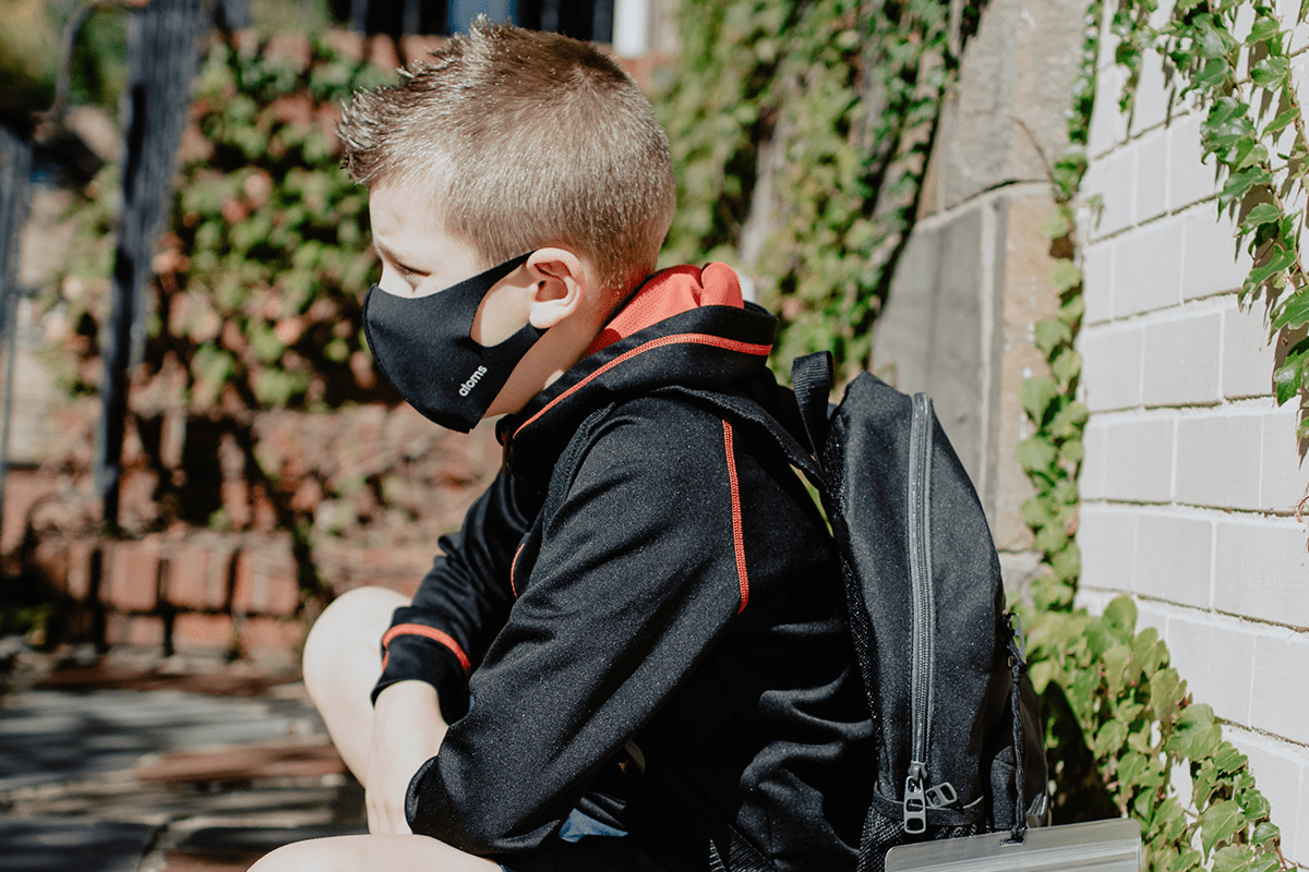 School-aged boy wears a mask during the COVID-19 pandemic, Oct. 19, 2020.