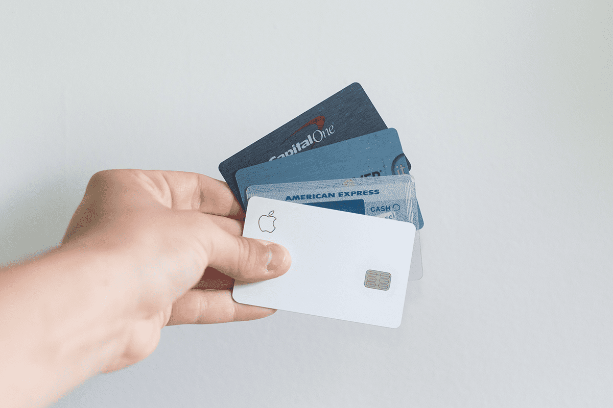 A person holding credit cards against a white background wall, May 17, 2020. (Photo/Avery Evans)