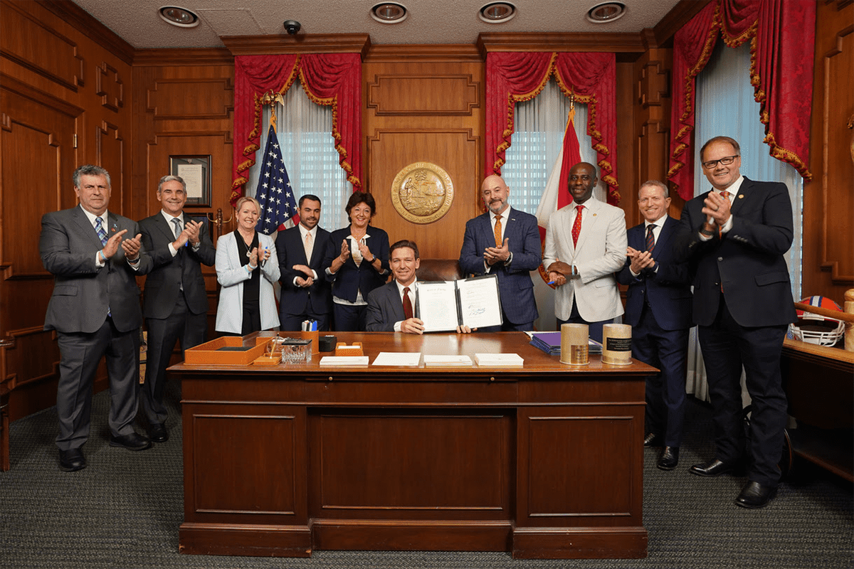 Gov. Ron DeSantis signs bill to lower jury threshold for death penalty sentencing, joined by parents of the victims of the Parkland mass murder, Tallahassee, Fla., April 20, 2023. (Photo/Gov. Ron DeSantis' office)