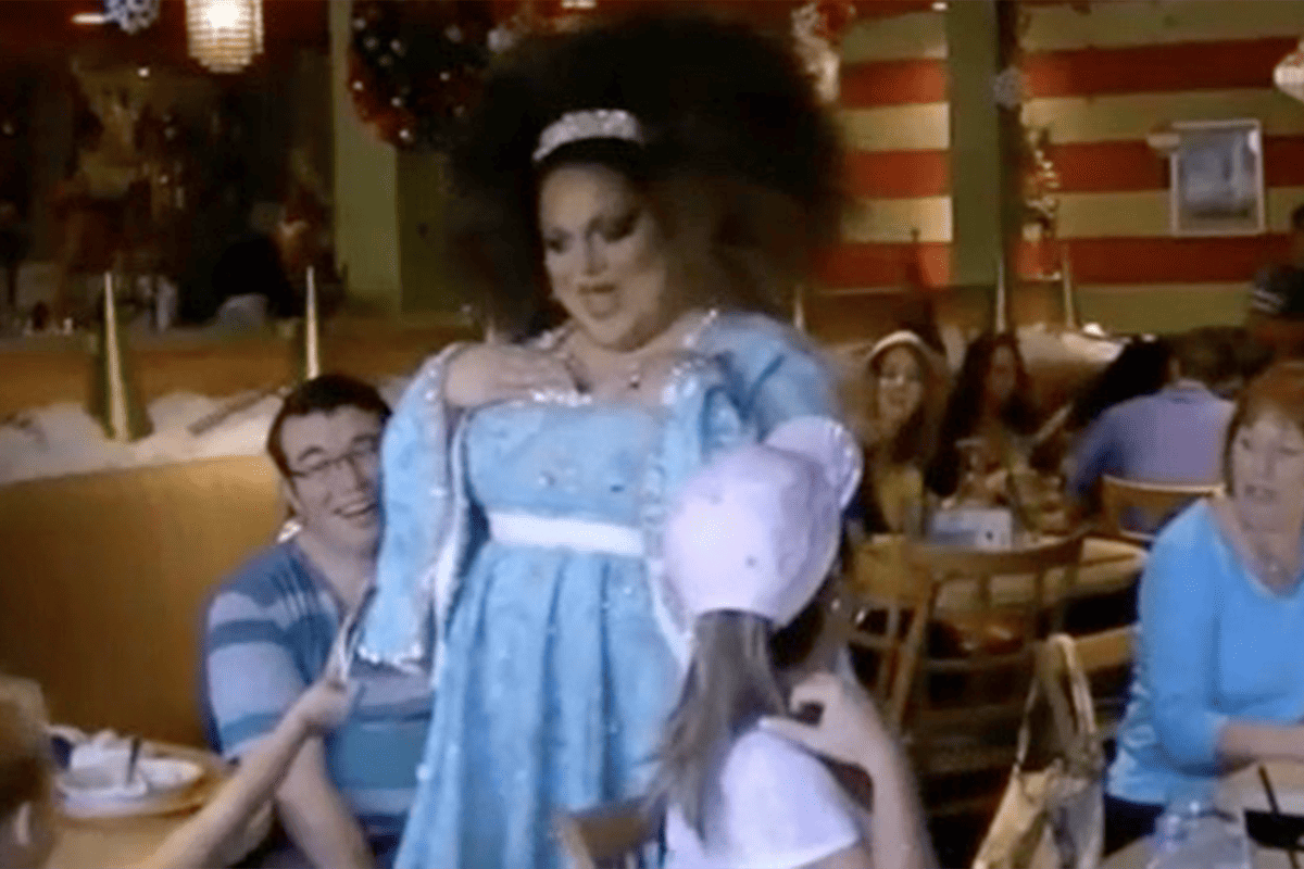 Child told by drag performer to put cash in performer's shirt at Hamburger Mary's.