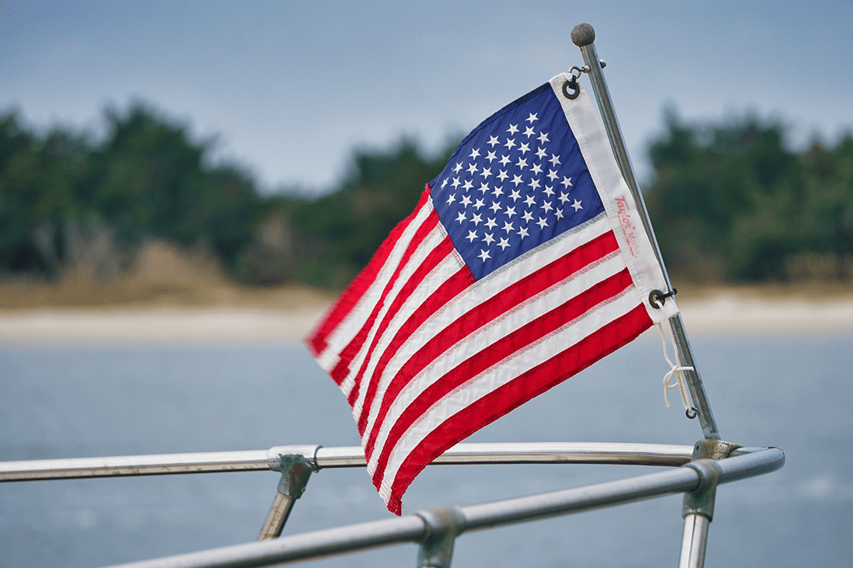 American flag attached to the bow rail of a boat out in the water in Beaufort, N.C., Dec. 1, 2020. (Photo/Gene Gallin, Unsplash)