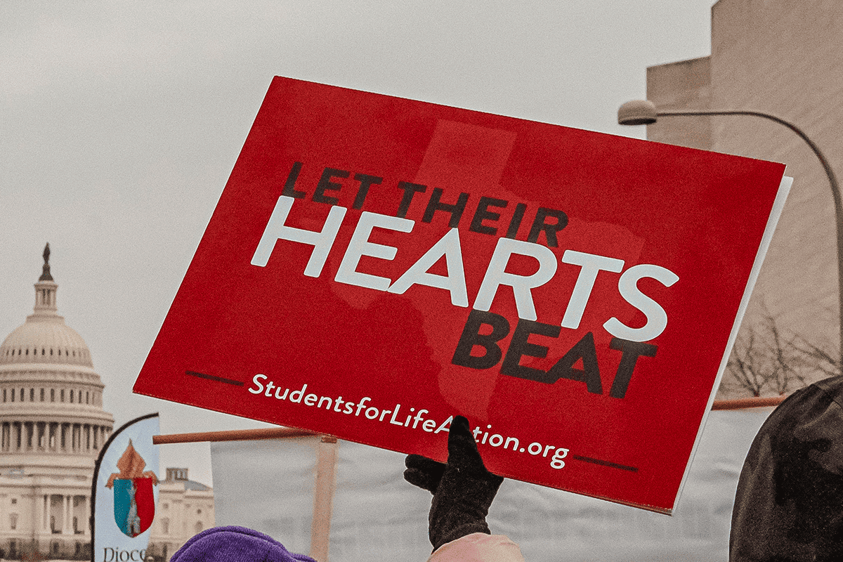 "Let Their Hearts Beat" pro-life sign in Washington, D.C., Jan. 25, 2022. (Photo/Maria Oswalt, Unsplash)