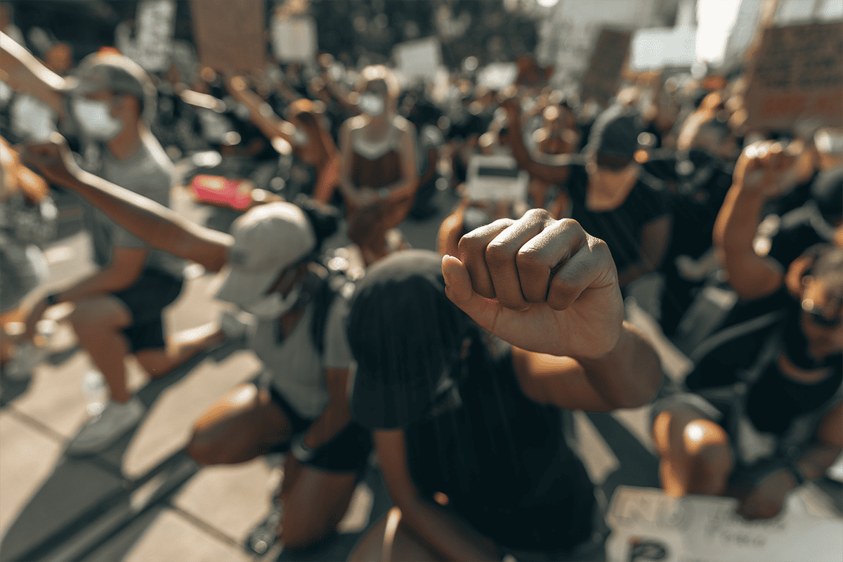 Protestors raising their firsts in Charlotte, N.C., June 3, 2020. (Photo/Clay Banks, Unsplash)