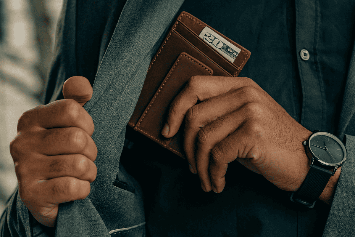 Man with a wallet, Nov. 17, 2021. (Photo/Clay Banks, Unsplash)