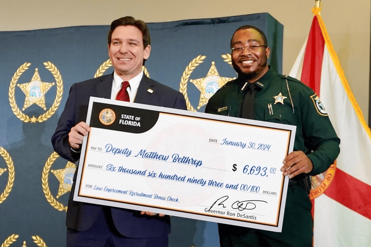 Gov. Ron DeSantis hands out 4,000th law enforcement recruitment bonus check, Tallahassee, Fla., Jan. 30, 2024. (Photo/DeSantis' office)