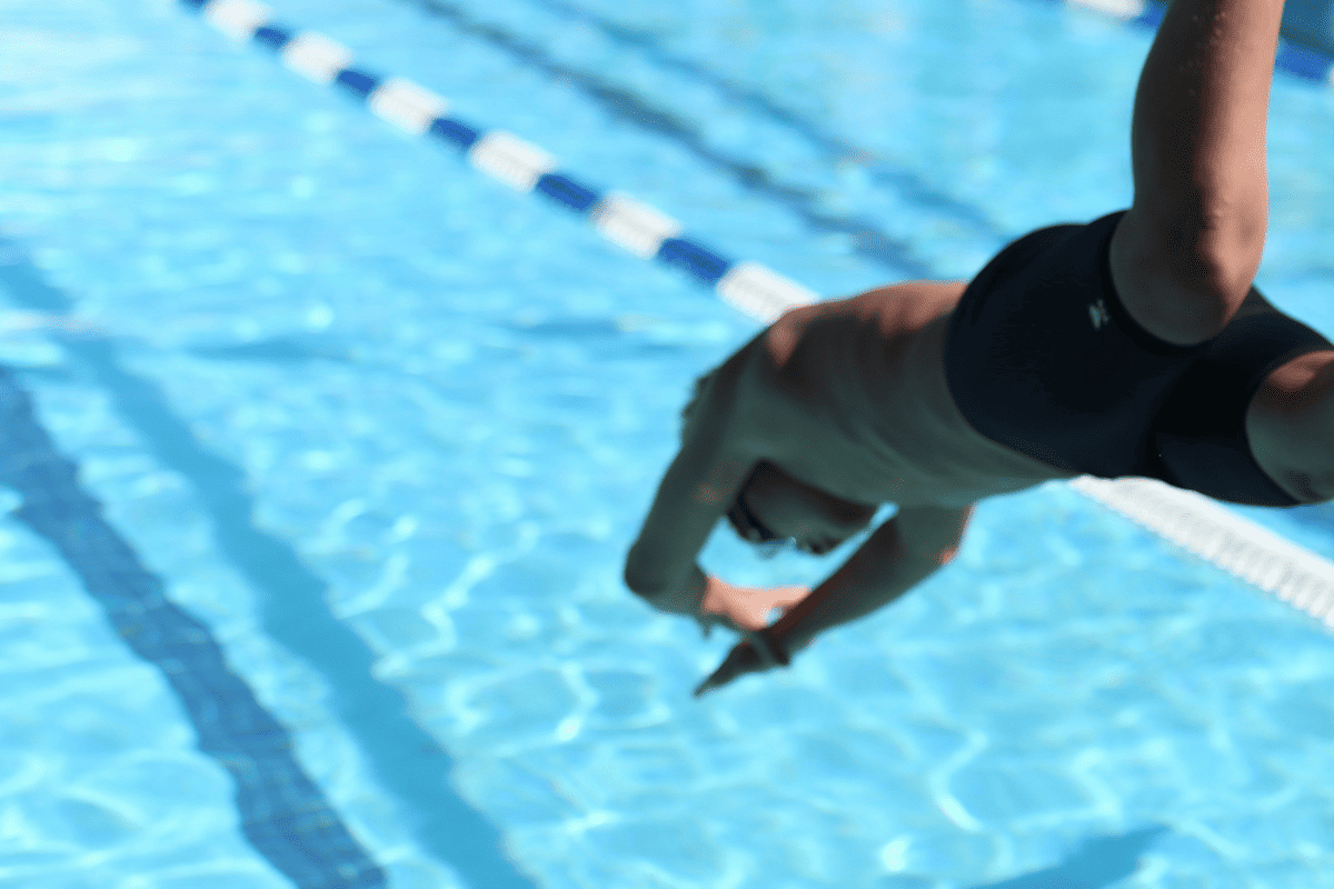 Child diving into a pool, Sept. 24, 2020. (Photo/Brian Matangelo, Unsplash)
