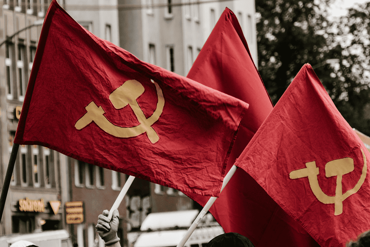 Communist flags, May 2, 2021. (Photo/Moises Gonzalez, Unsplash)