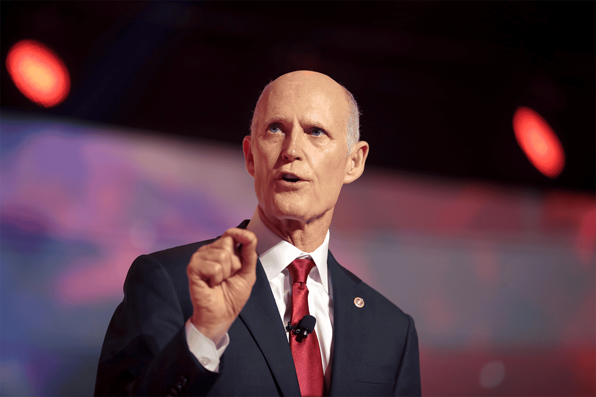 <a href=https://www.flickr.com/photos/gageskidmore/52251885298>U.S. Sen. Rick Scott, R-Fla., speaking with attendees at the 2022 Student Action Summit at the Tampa Convention Center in Tampa, Fla., July 23, 2022.</a> (Photo/Gage Skidmore, Flickr)